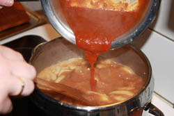 Puting roux into Hungarian bean soup